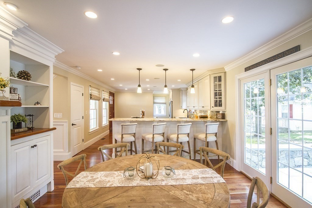 41-43 Stone Street Walpole, MA 02081 - Photo 6 of 36 a large kitchen with kitchen island a large window and a counter space