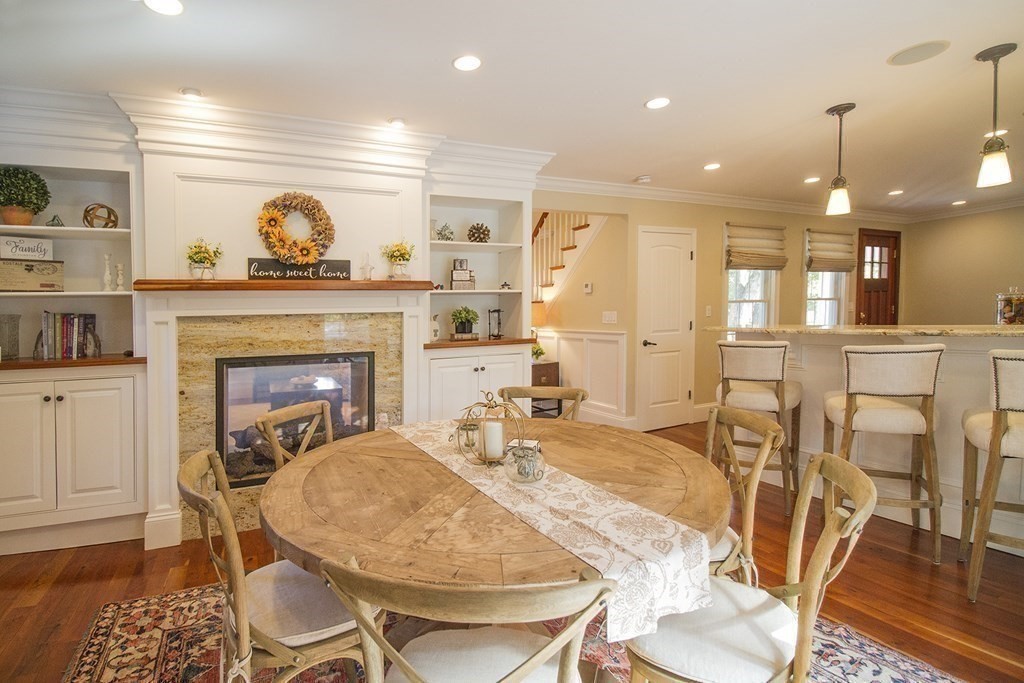 41-43 Stone Street Walpole, MA 02081 - Photo 7 of 36 a living room with furniture a fireplace and wooden floor