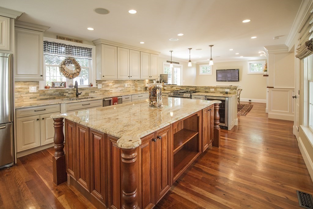 41-43 Stone Street Walpole, MA 02081 - Photo 8 of 36 a kitchen with stainless steel appliances granite countertop a kitchen island a stove a sink a refrigerator and a oven