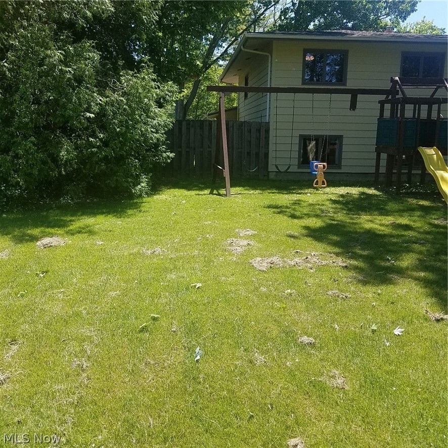 Fenced Dog run on left side of home.