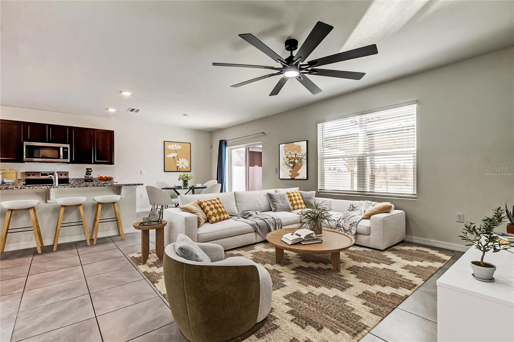 3845 Rory Pond Court Lakeland, FL 33811 - Photo 11 of 68 a living room with furniture and view of kitchen