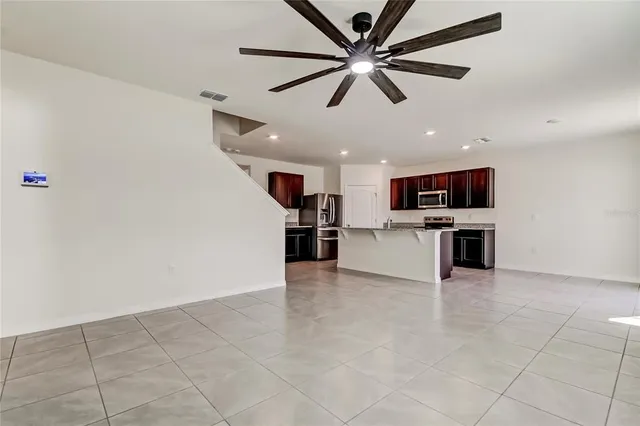 a bedroom with a large bed and a flat screen tv