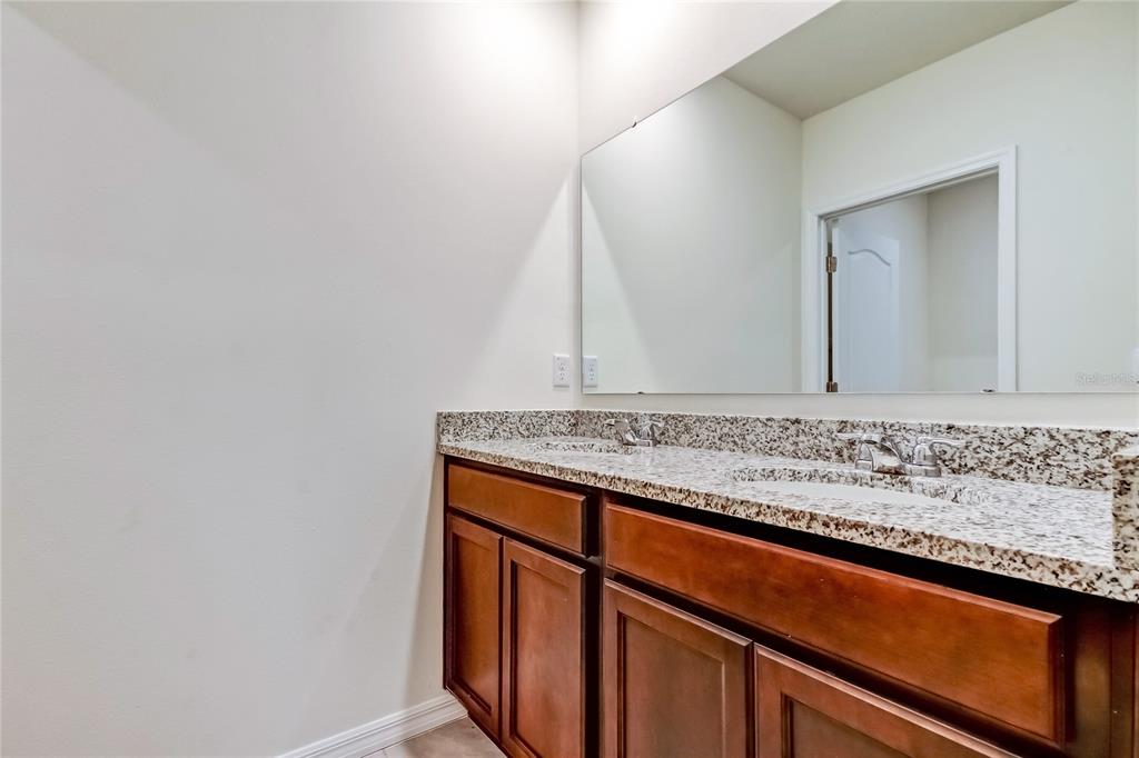 3845 Rory Pond Court Lakeland, FL 33811 - Photo 51 of 68 a view of bathroom with sink and mirror