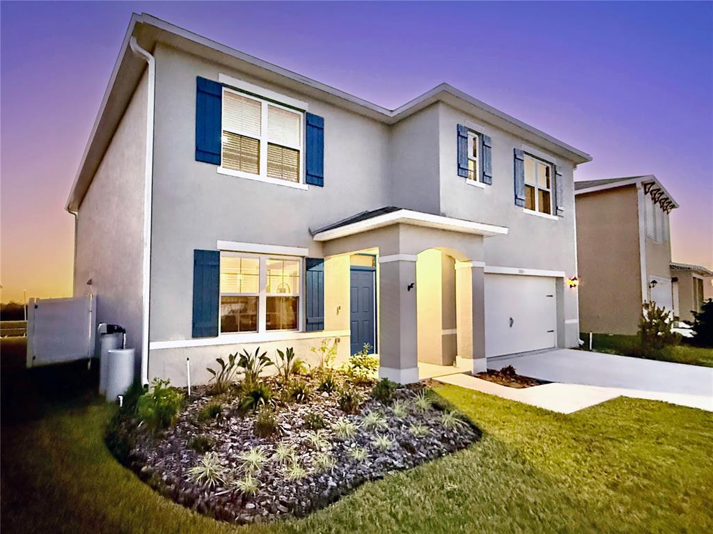 3845 Rory Pond Court Lakeland, FL 33811 - Photo 6 of 68 a front view of a house with garden