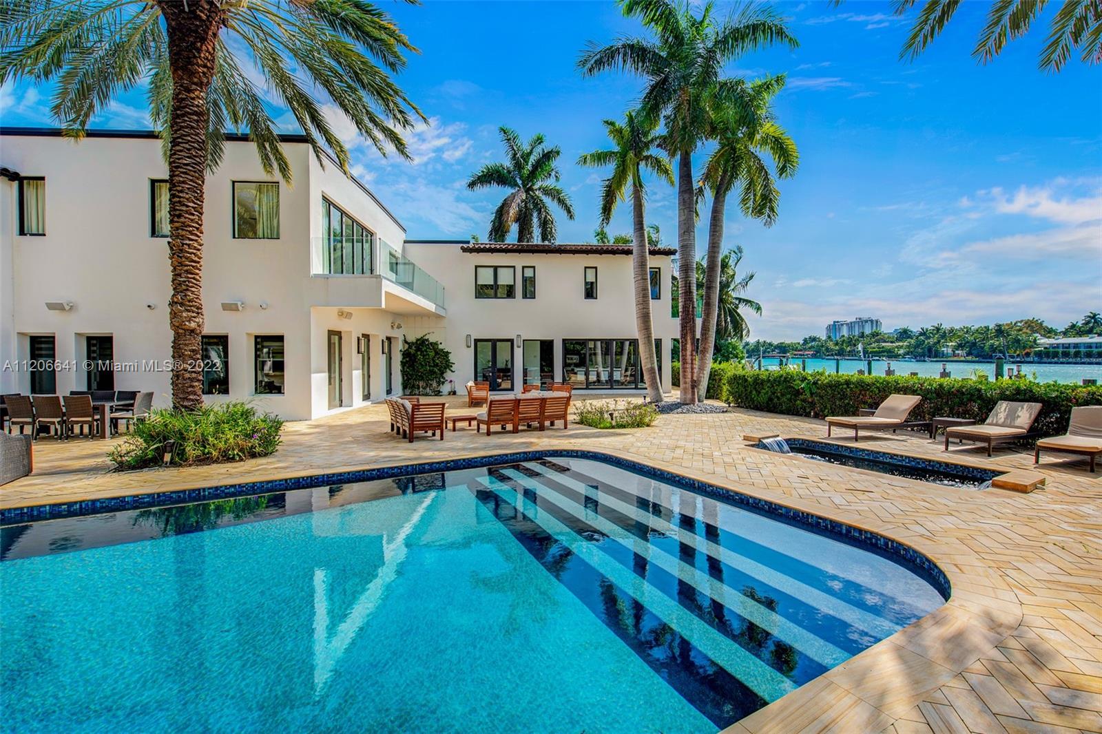 2700 North Bay Road Miami Beach, FL 33140 - Photo 1 of 42 a view of a swimming pool with a patio