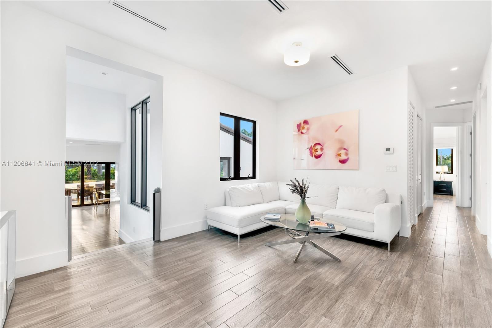 2700 North Bay Road Miami Beach, FL 33140 - Photo 25 of 42 a living room with furniture and wooden floor