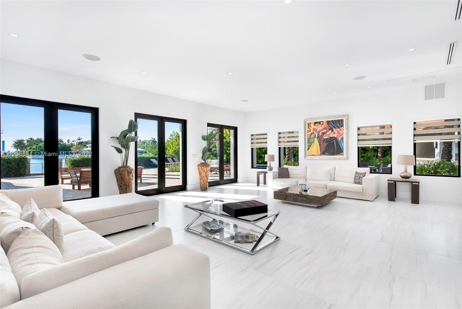 2700 North Bay Road Miami Beach, FL 33140 - Photo 3 of 42 a living room with furniture and large windows