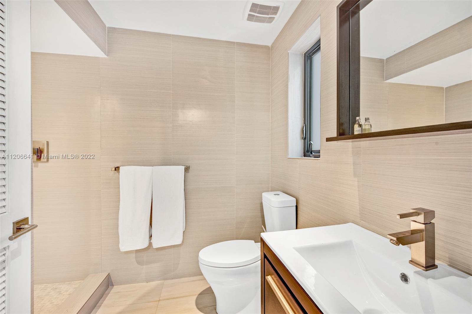 2700 North Bay Road Miami Beach, FL 33140 - Photo 39 of 42 a bathroom with a sink toilet and shower