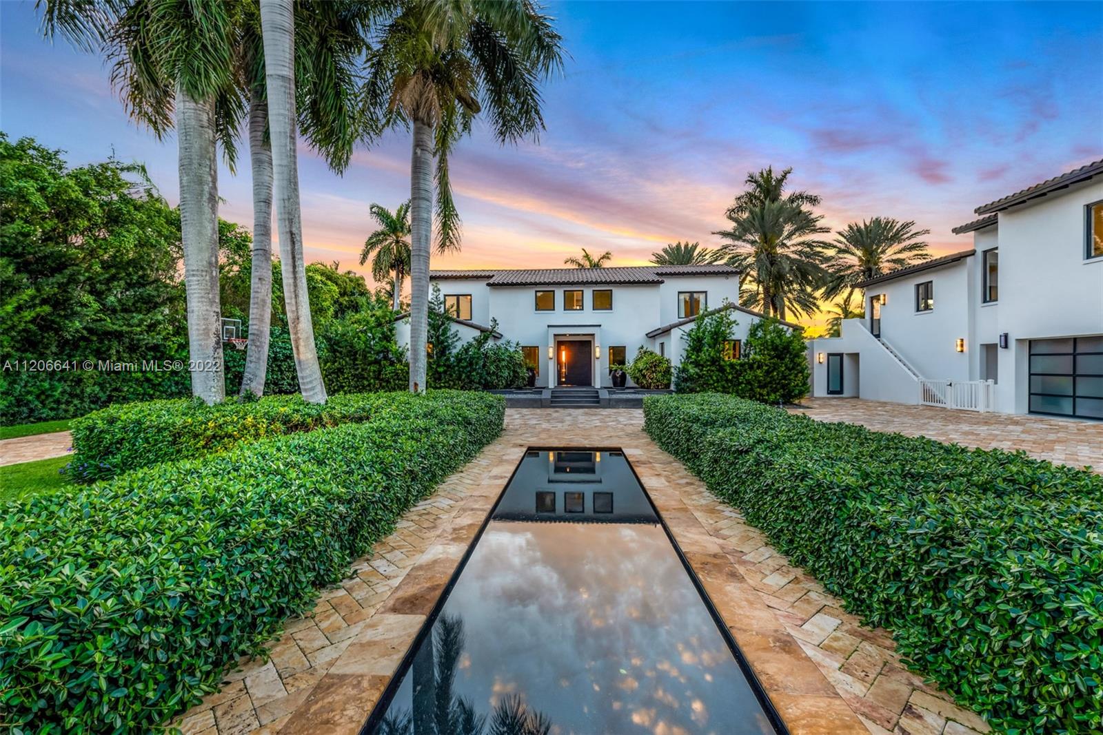 2700 North Bay Road Miami Beach, FL 33140 - Photo 40 of 42 a front view of a house with a yard