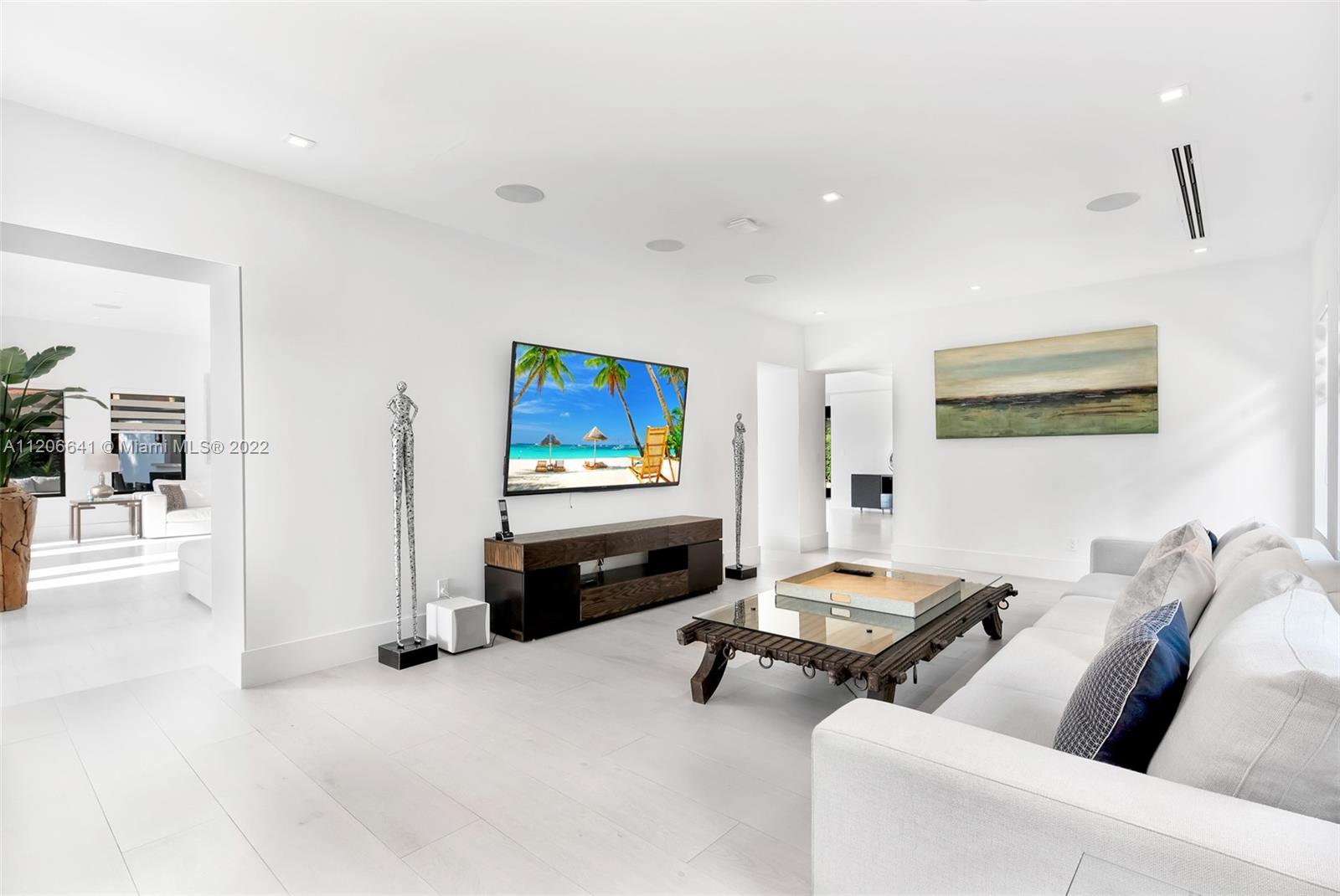 2700 North Bay Road Miami Beach, FL 33140 - Photo 6 of 42 a living room with furniture and a flat screen tv