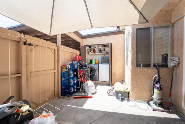 a view of a couches and table in the balcony