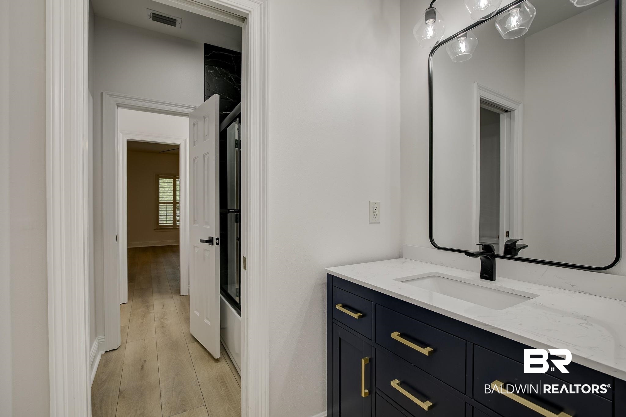 105 High Pines Ridge Fairhope, AL 36532 - Photo 76 of 97 Bathroom featuring wood finished floors, vanity, and baseboards