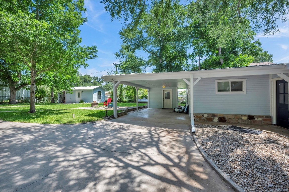 1946 Granite Cove Road Kingsland, TX 78639 - Photo 16 of 31 a view of a house with a backyard