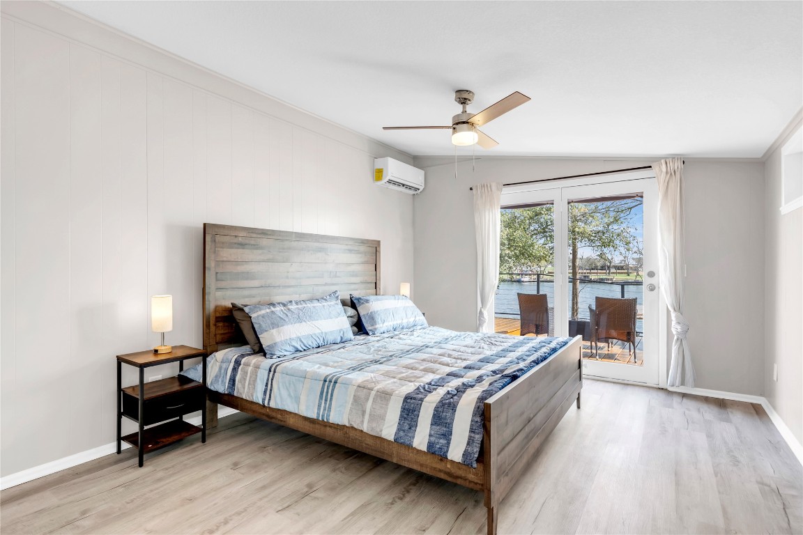 1946 Granite Cove Road Kingsland, TX 78639 - Photo 17 of 31 a bedroom with a bed and a window