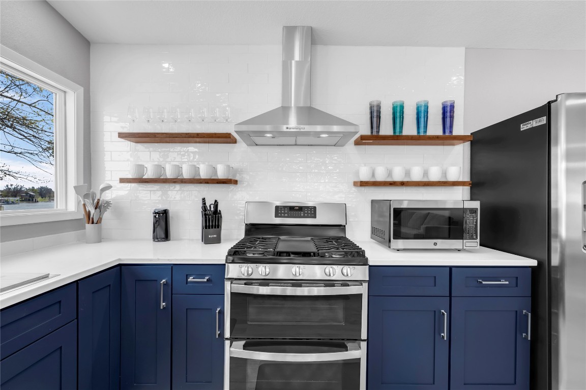 1946 Granite Cove Road Kingsland, TX 78639 - Photo 10 of 31 a kitchen with a stove and a microwave