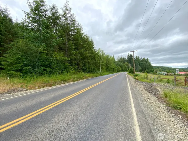 a view of a road with a yard