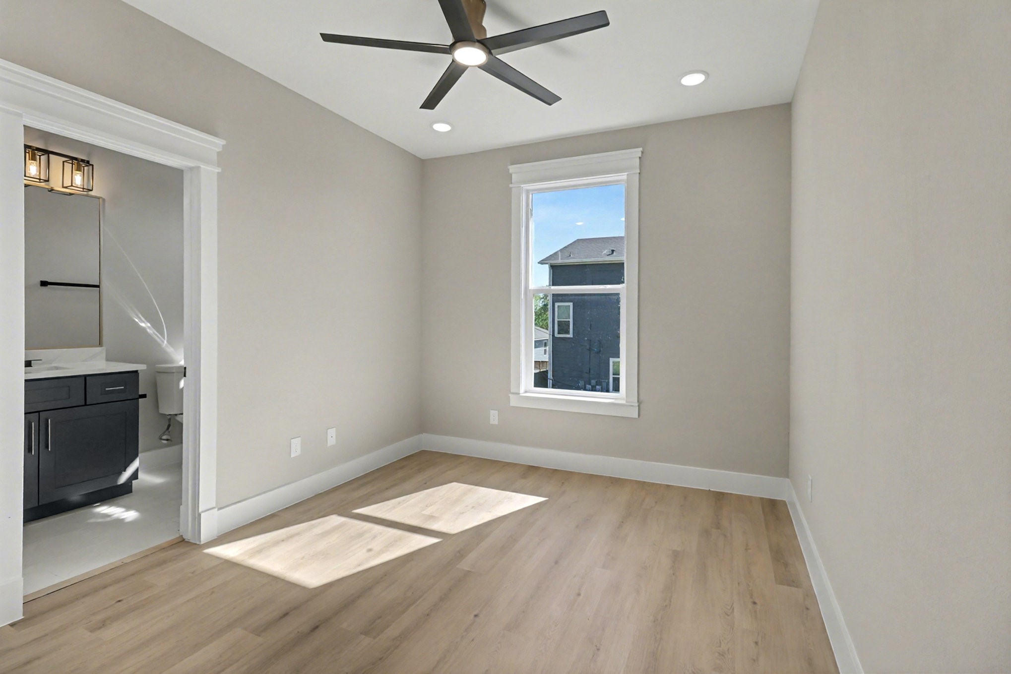 5000 Higgins Street, Unit A Houston, TX 77033 - Photo 26 of 32 wooden floor in an empty room with a window