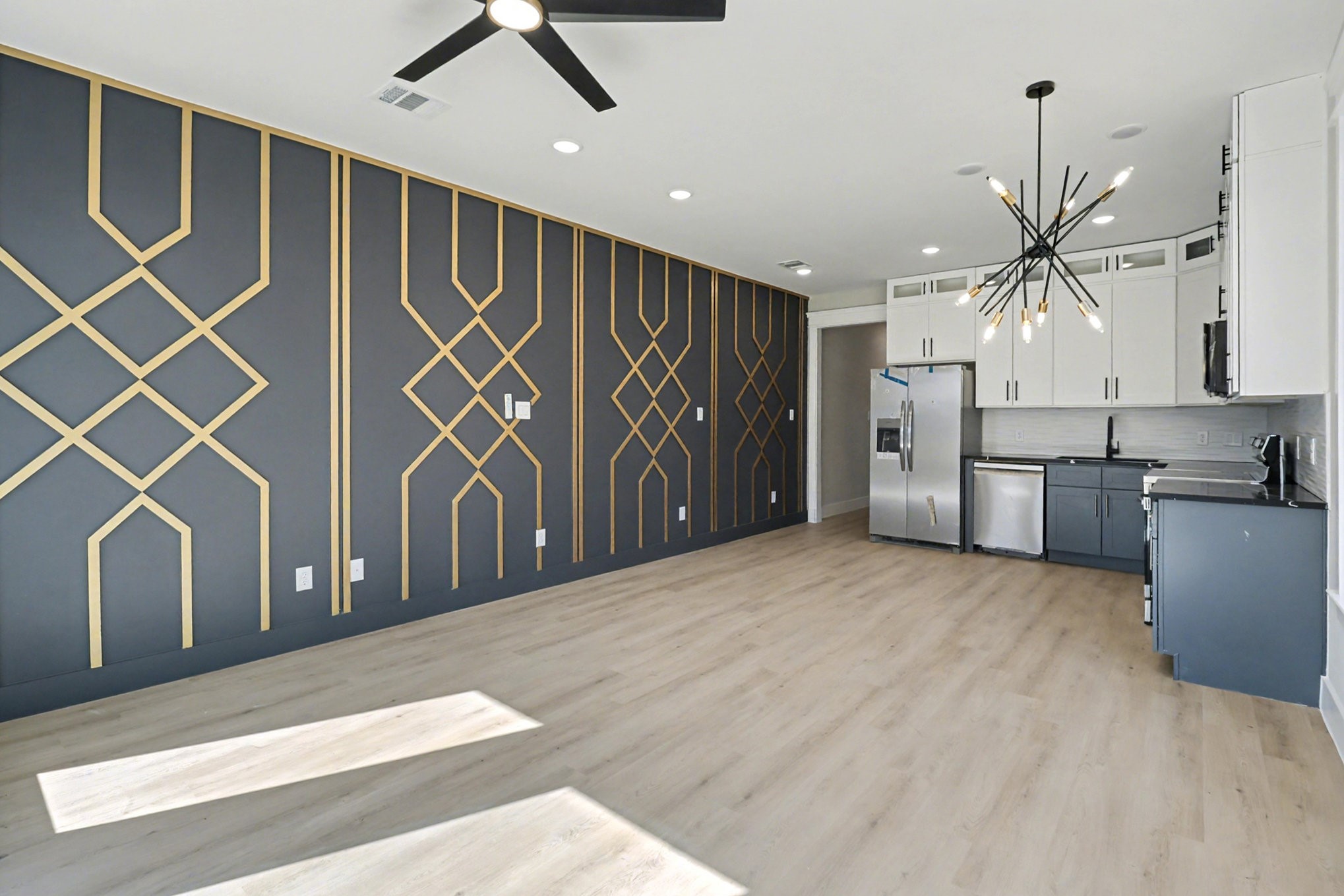 5000 Higgins Street, Unit A Houston, TX 77033 - Photo 8 of 32 a view of a livingroom with a ceiling fan