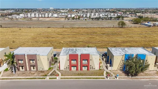 an aerial view of a building with outdoor space