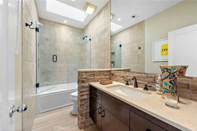a bathroom with a sink double vanity and shower