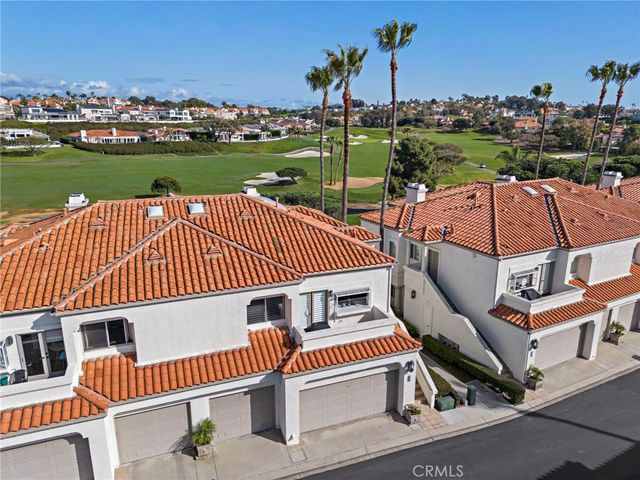 an aerial view of a house with a garden