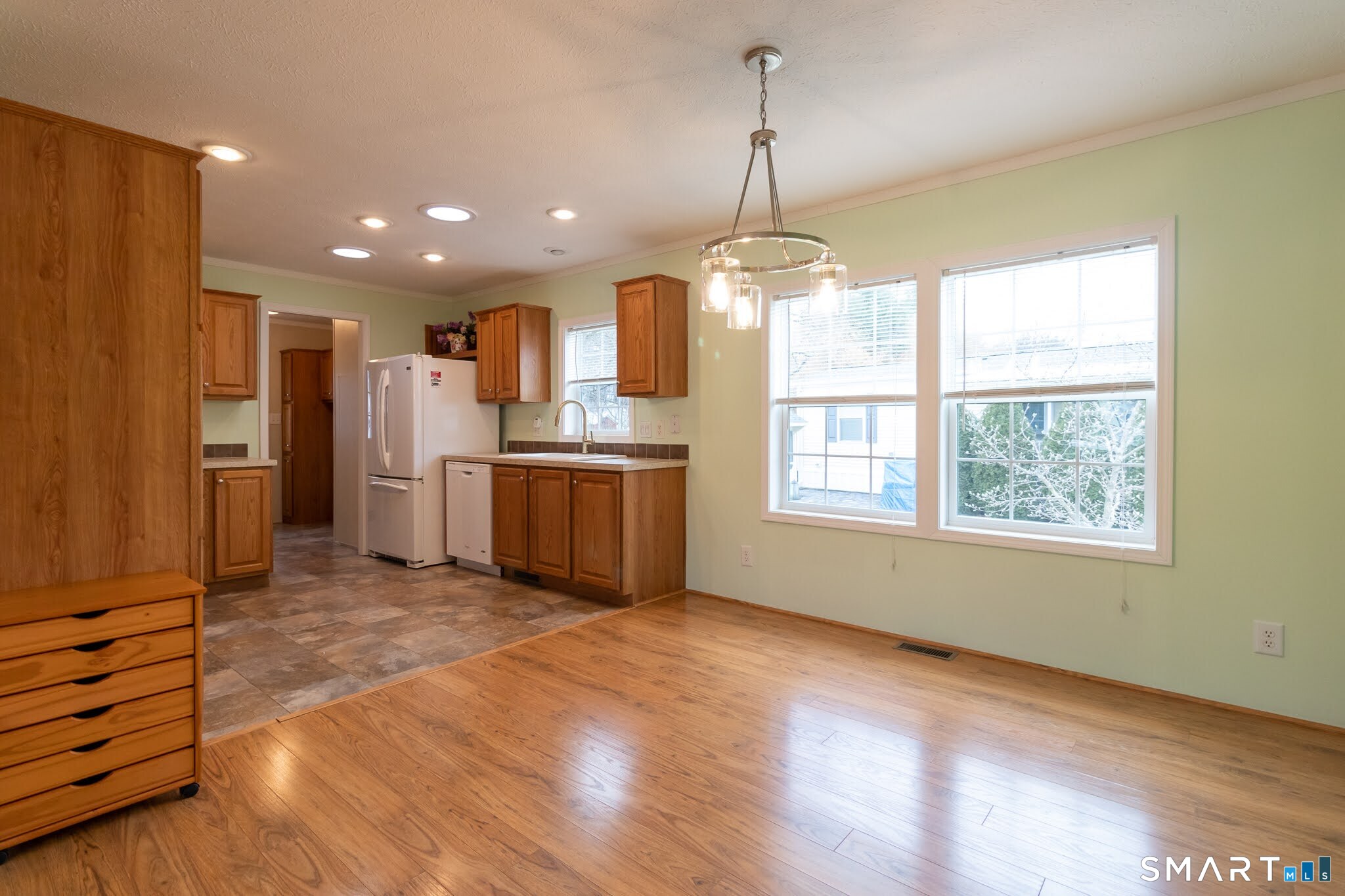 39 Riverside Drive Southington, CT 06489 - Photo 14 of 40 a view of kitchen with refrigerator microwave and window