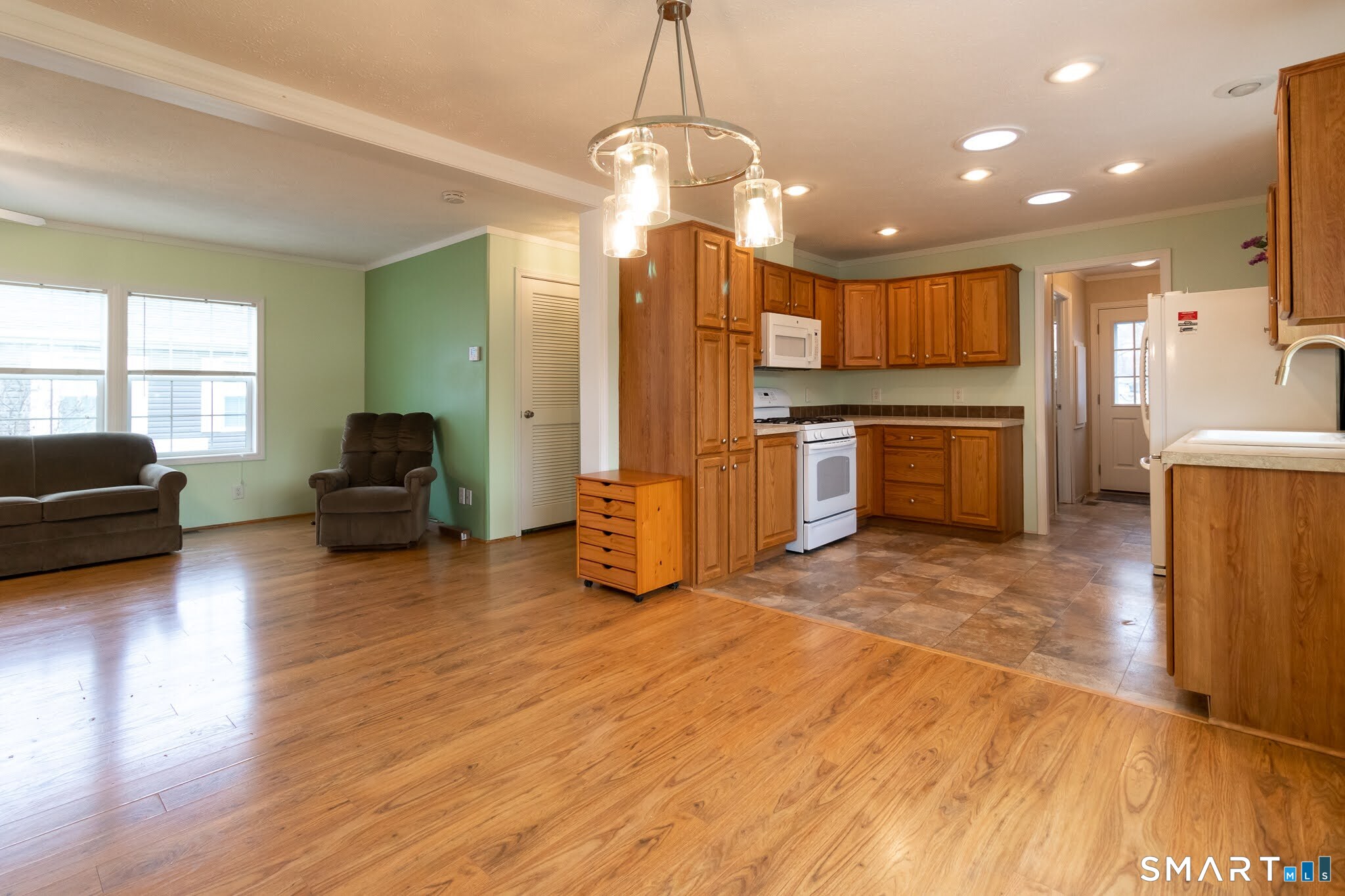 39 Riverside Drive Southington, CT 06489 - Photo 15 of 40 a living room with stainless steel appliances furniture a couch and a large window
