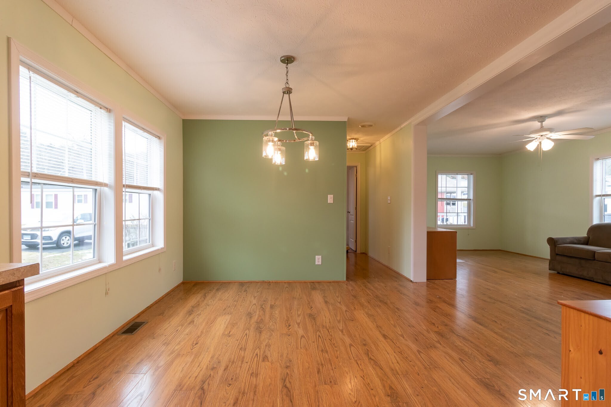39 Riverside Drive Southington, CT 06489 - Photo 17 of 40 a view of an empty room with window and wooden floor