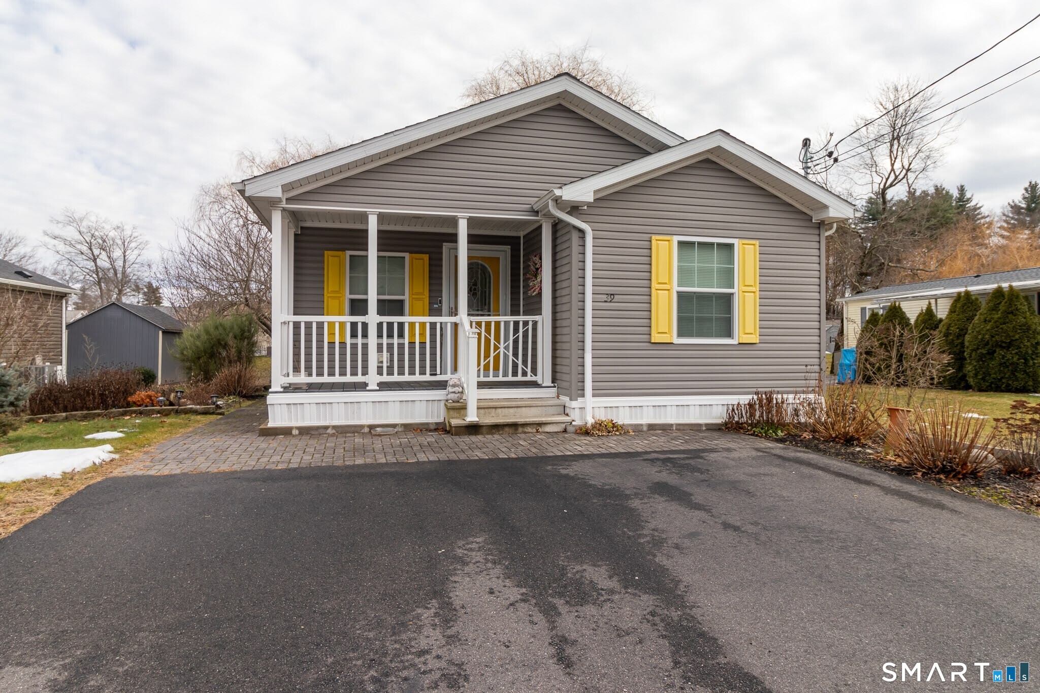 39 Riverside Drive Southington, CT 06489 - Photo 2 of 40 a front view of a house with a yard and garage