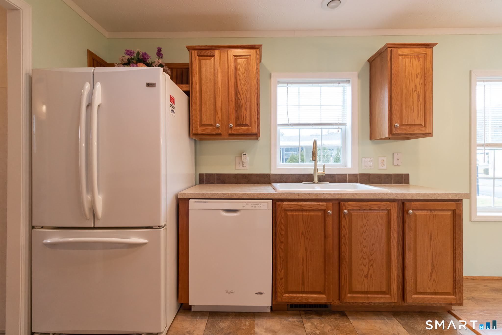 39 Riverside Drive Southington, CT 06489 - Photo 21 of 40 a white refrigerator freezer sitting in a kitchen