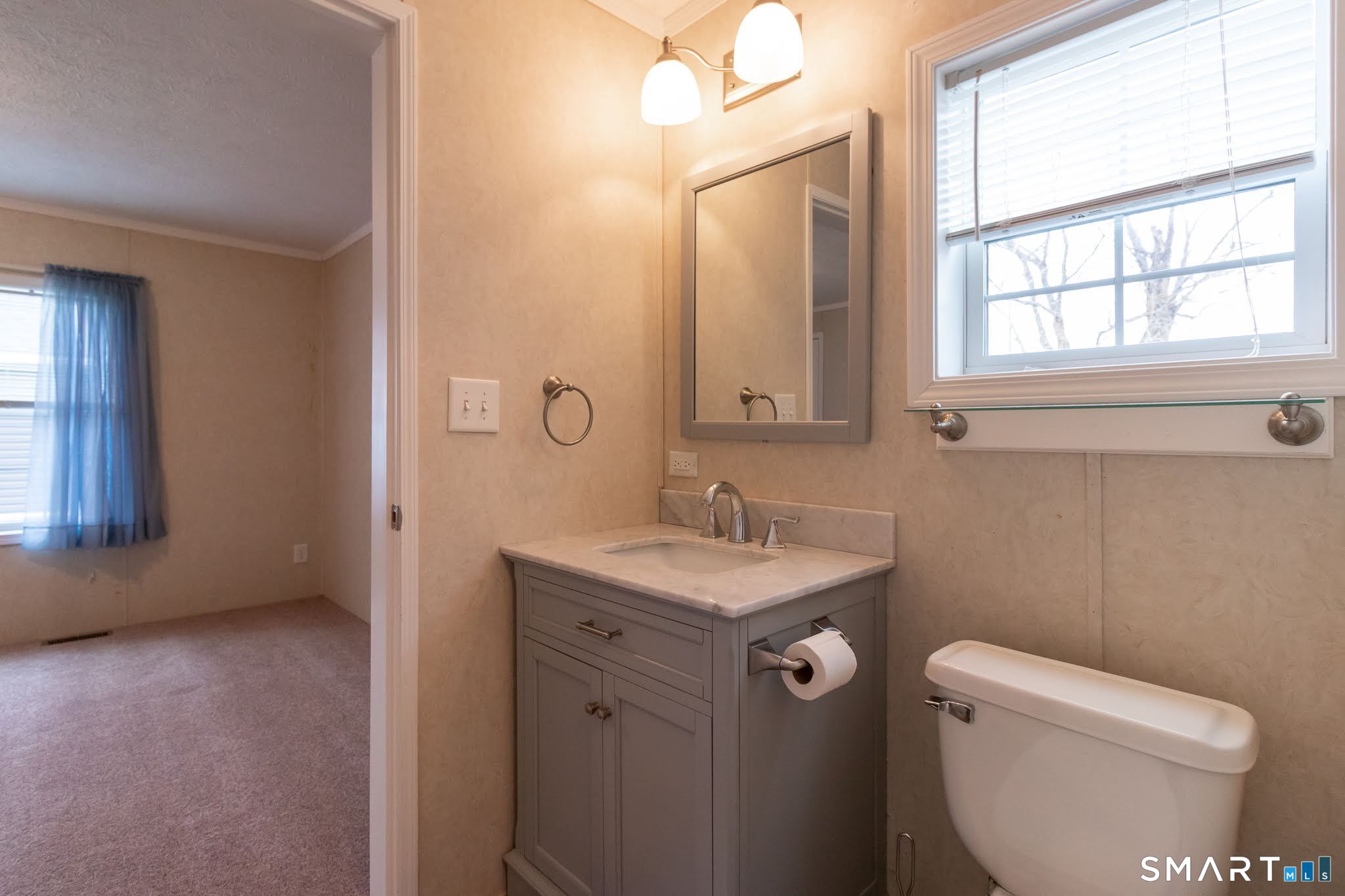 39 Riverside Drive Southington, CT 06489 - Photo 23 of 40 a bathroom with a granite countertop toilet a sink and a mirror