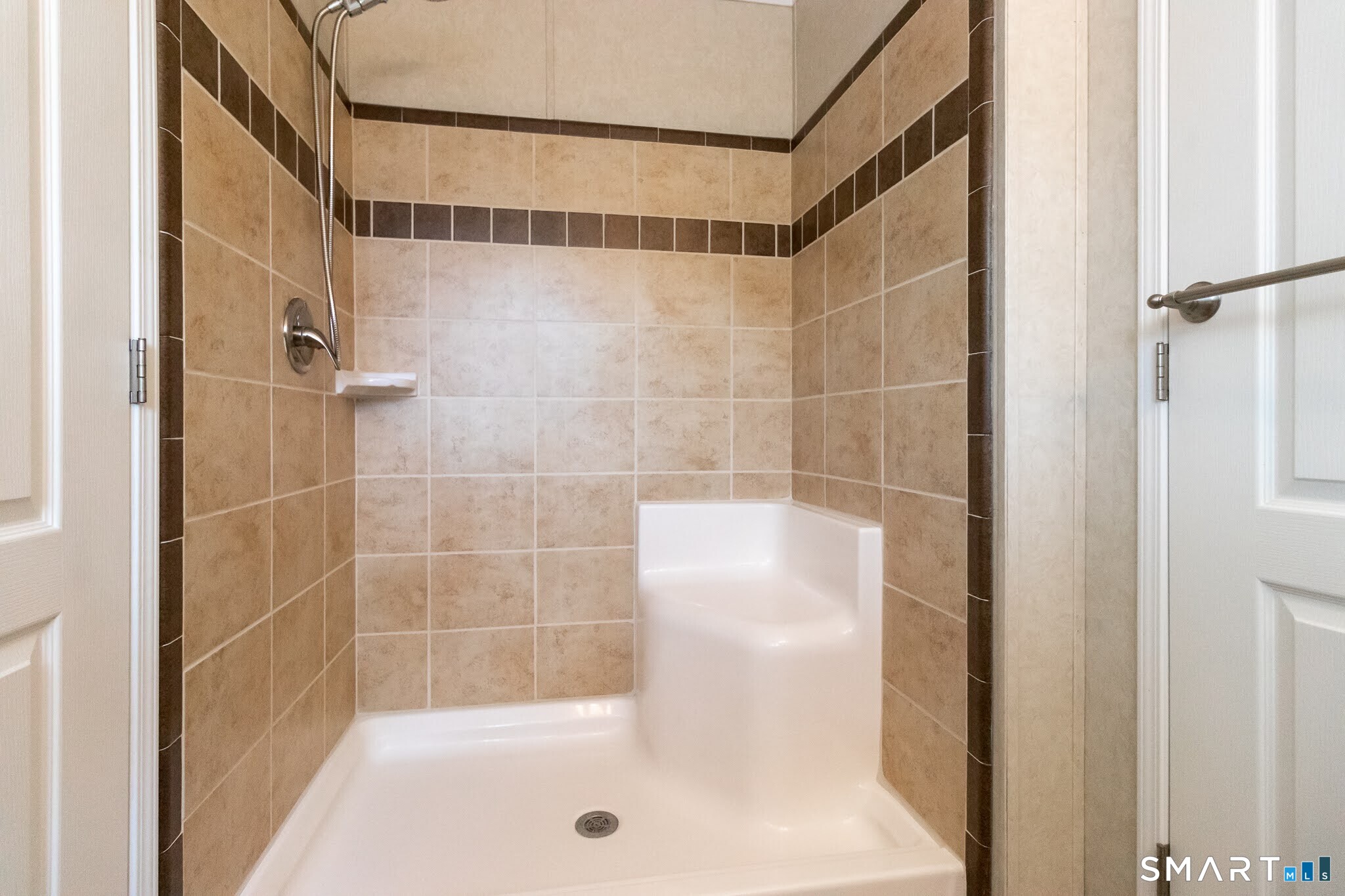 39 Riverside Drive Southington, CT 06489 - Photo 25 of 40 a bathroom with a shower and a bathtub