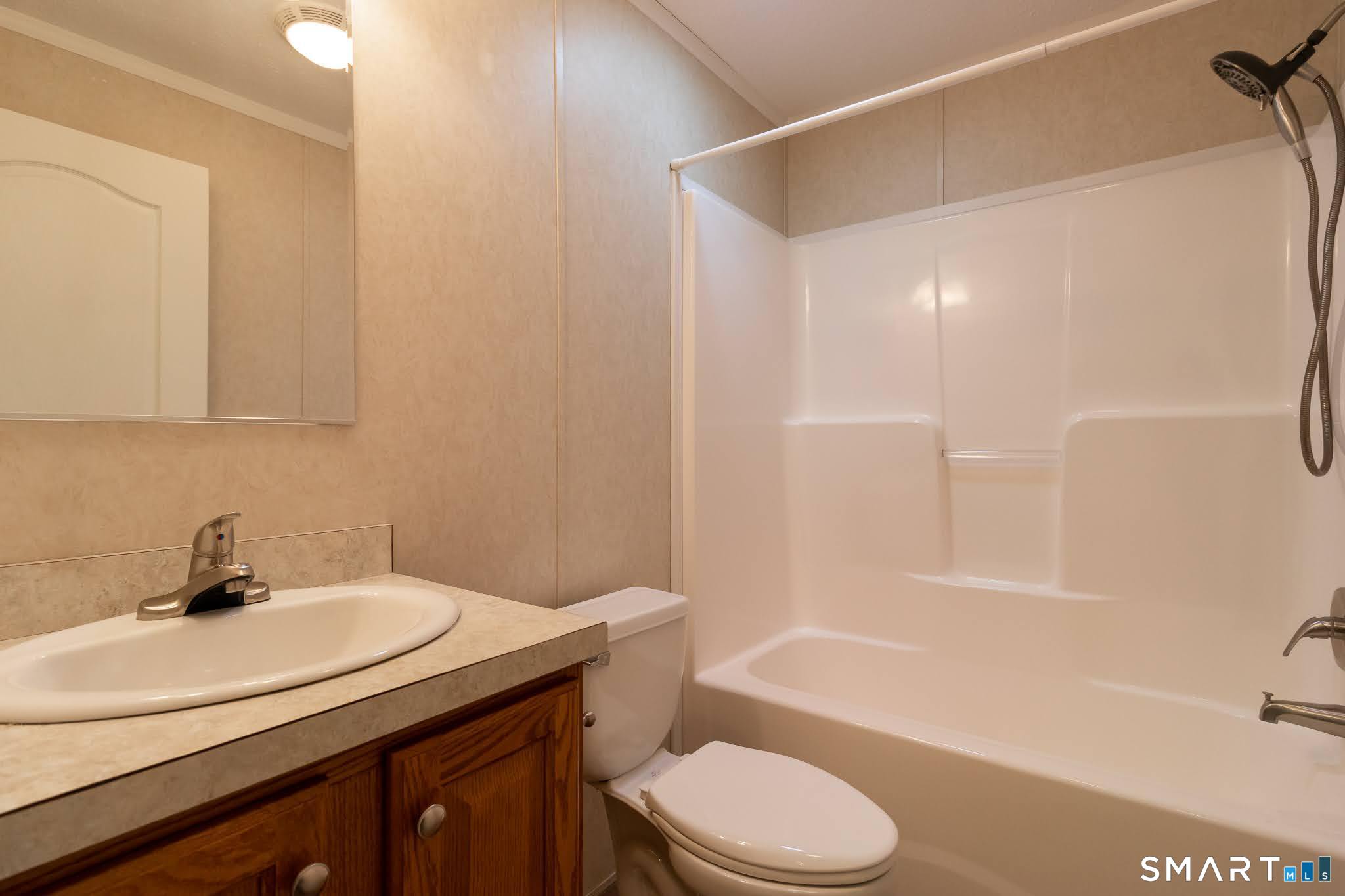 39 Riverside Drive Southington, CT 06489 - Photo 30 of 40 a bathroom with a sink a toilet and bathtub