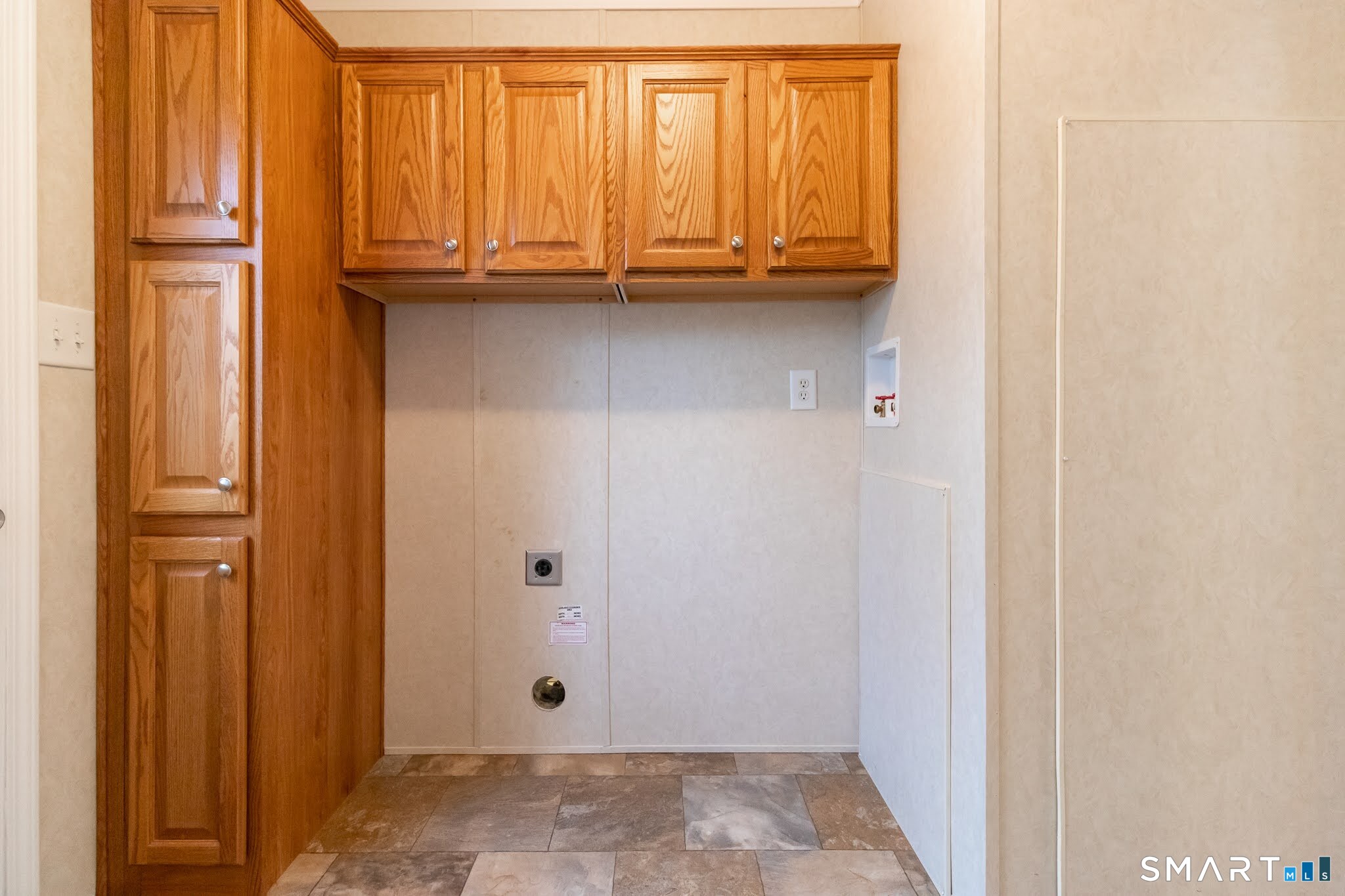 39 Riverside Drive Southington, CT 06489 - Photo 36 of 40 a view of door with washer and dryer