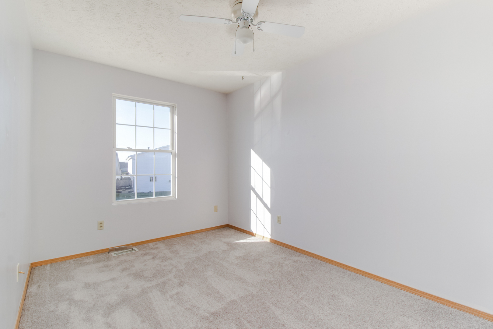 2 Andy Court, Unit 3 Bloomington, IL 61704 - Photo 10 of 13 a view of an empty room with a window