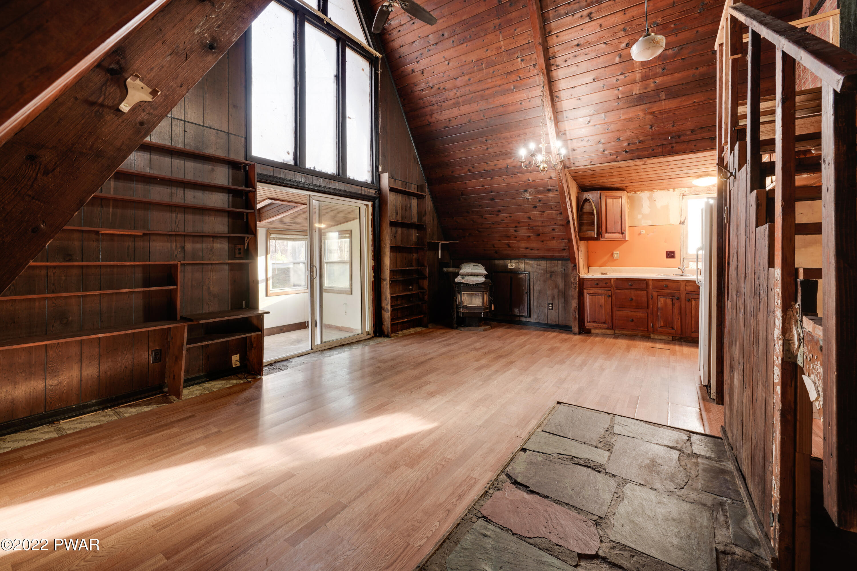 2513 Milford Road Bushkill, PA 18324 - Photo 10 of 24 a view of an empty room with wooden floor and windows