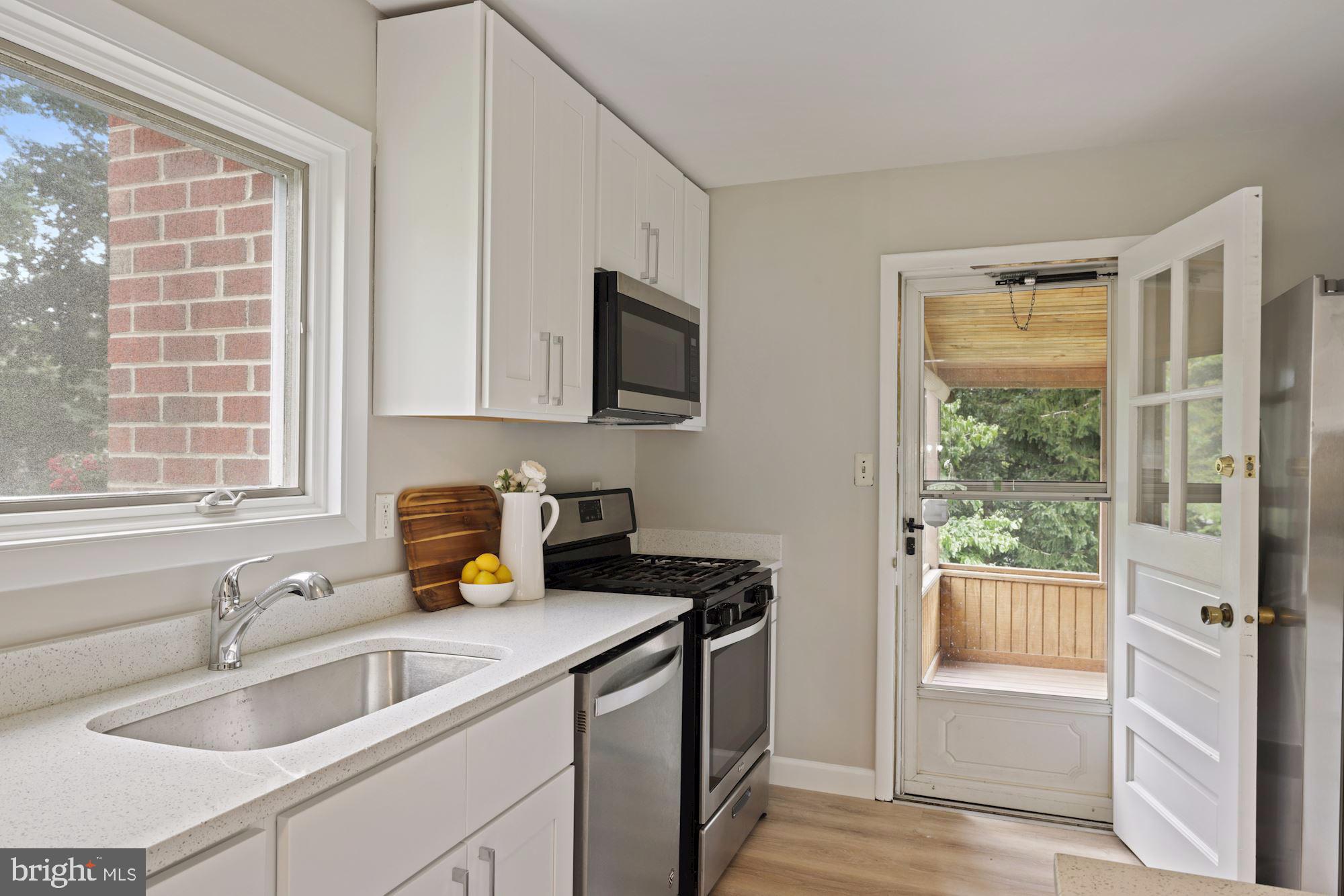 4014 Jeffry Street Silver Spring, MD 20906 - Photo 5 of 25 New White Kitchen Leads to Rear Porch