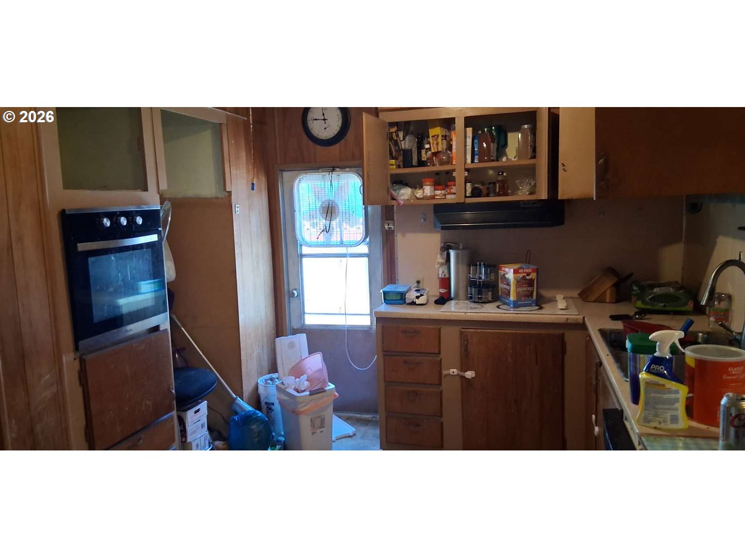 1413 Hawthorne Avenue, Unit 49 Reedsport, OR 97467 - Photo 3 of 10 a kitchen with a refrigerator and a stove