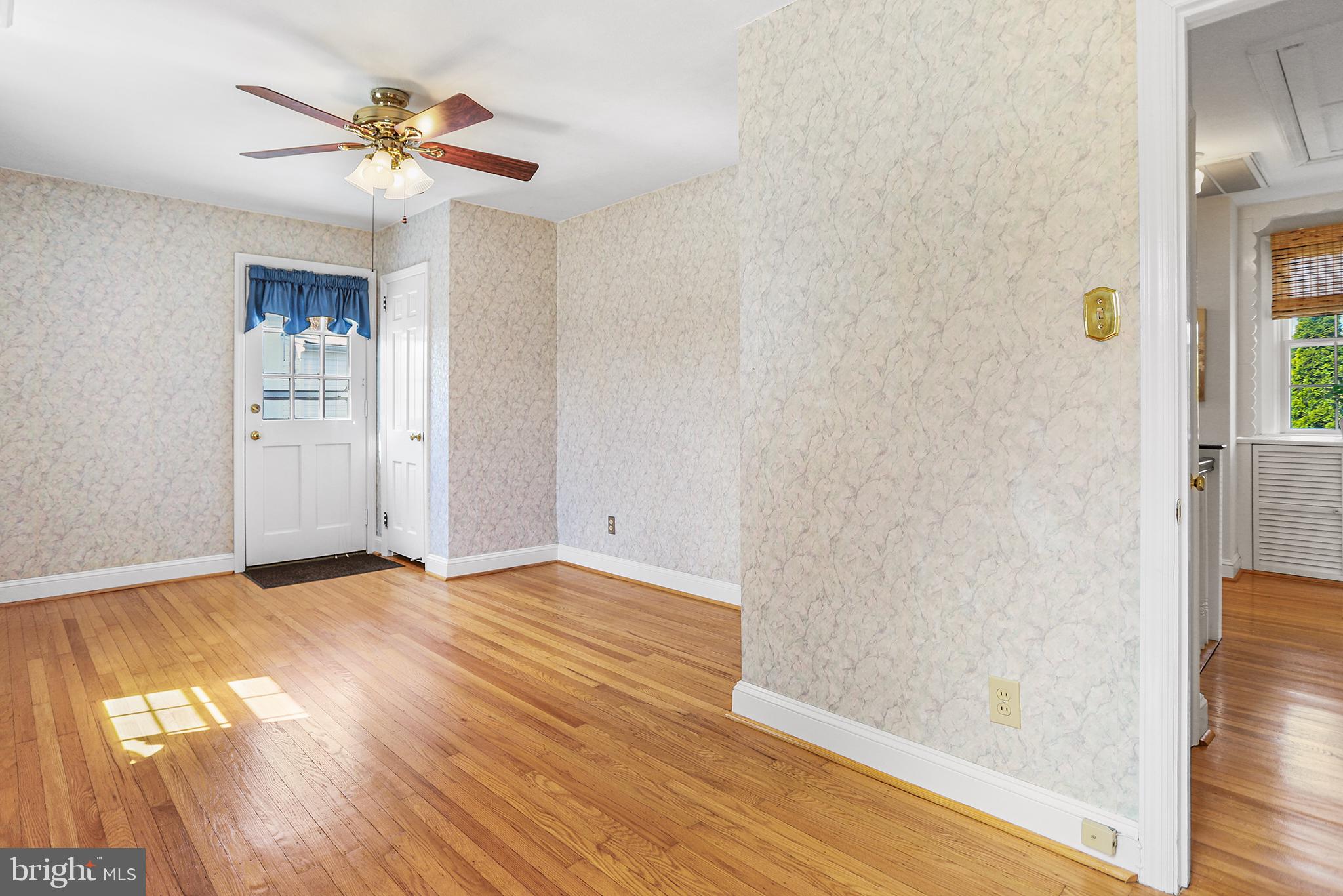 242 North Rolling Road Springfield, PA 19064 - Photo 18 of 37 a view of an empty room with window and wooden floor