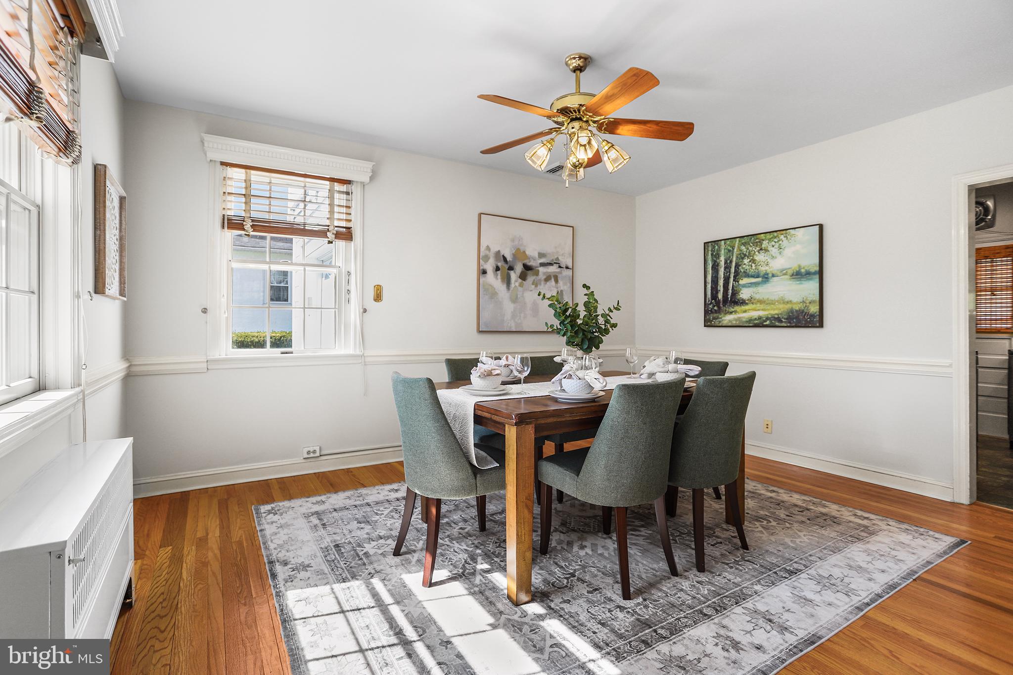 242 North Rolling Road Springfield, PA 19064 - Photo 8 of 37 a view of a dining room with furniture and wooden floor
