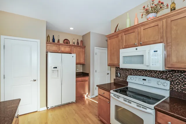 a kitchen with cabinets and a stove top oven