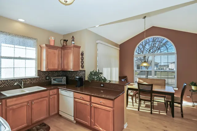 a kitchen with a sink and a large window
