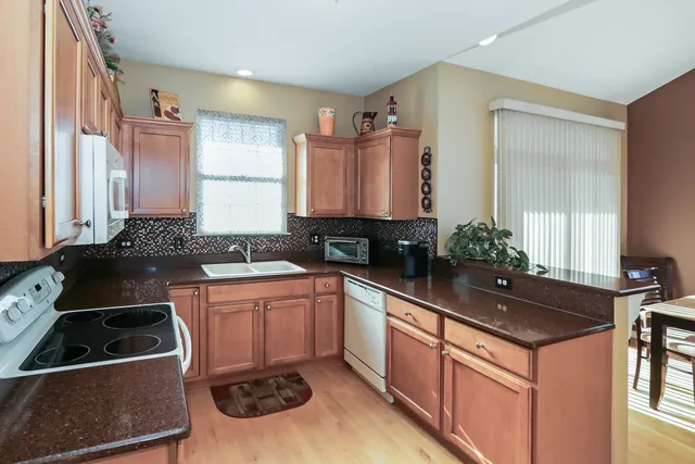 a kitchen that has a sink and a stove