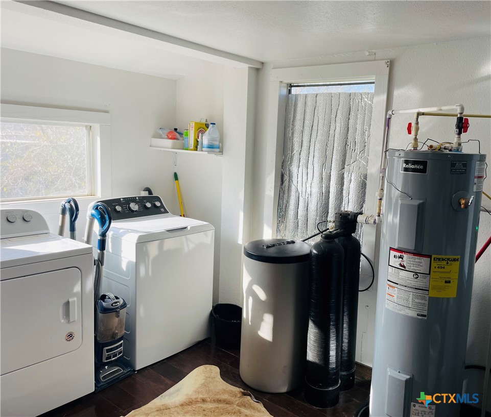 40 Cypress Valley Road Cuero, TX 77954 - Photo 11 of 24 a view of storage and utility room with washer and dryer