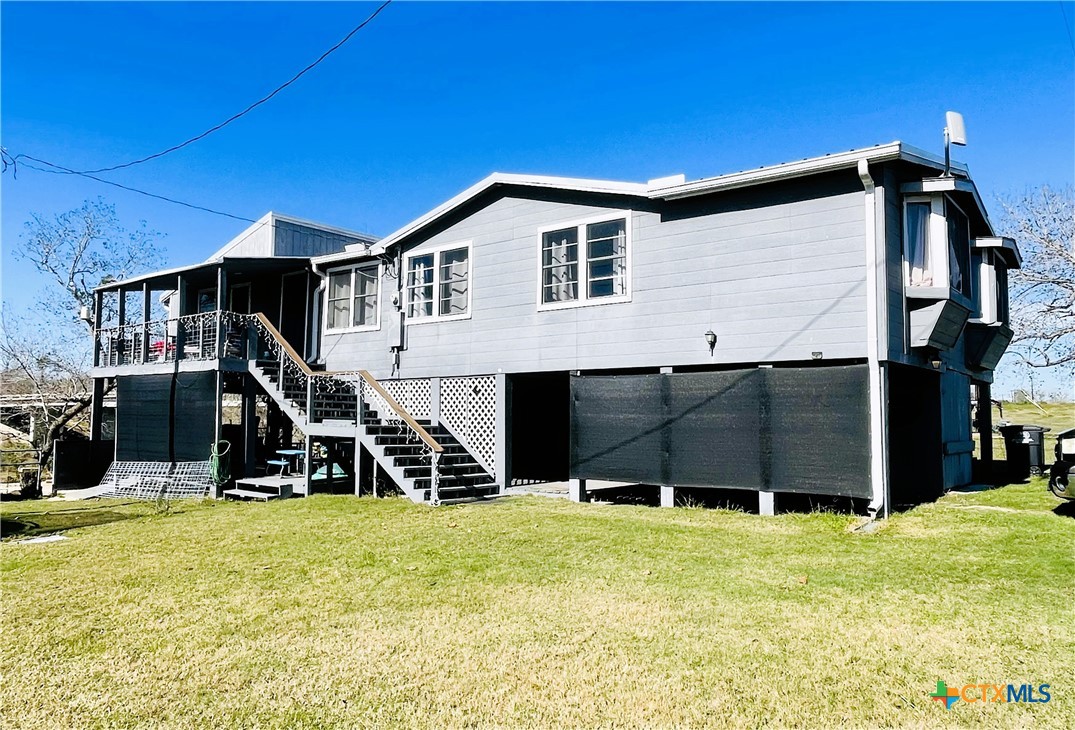 40 Cypress Valley Road Cuero, TX 77954 - Photo 15 of 19 a house with trees in the background