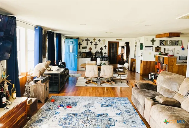 a bed room with furniture or couch and a flat screen tv