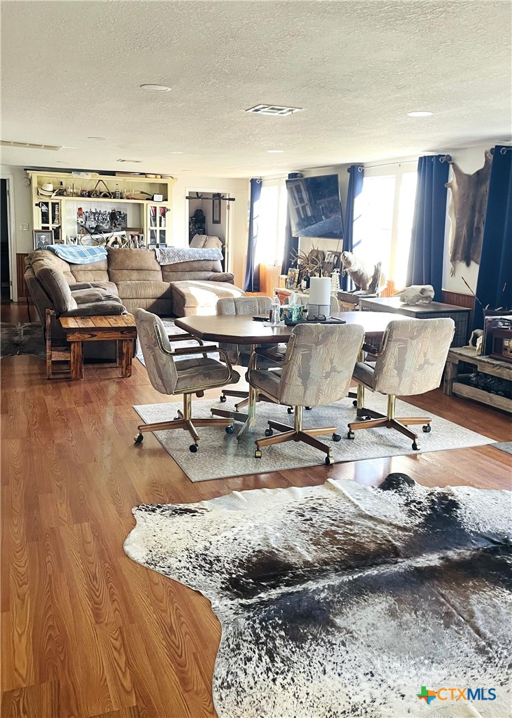 40 Cypress Valley Road Cuero, TX 77954 - Photo 4 of 24 a living room with furniture and a wooden floor