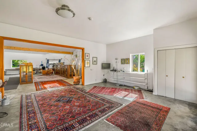 a view of a chairs and table in a patio
