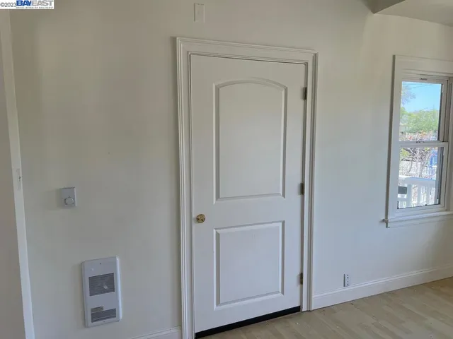 a view of a closet area with mirror