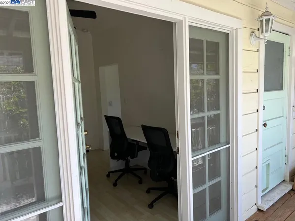 a view of a livingroom with furniture and a window
